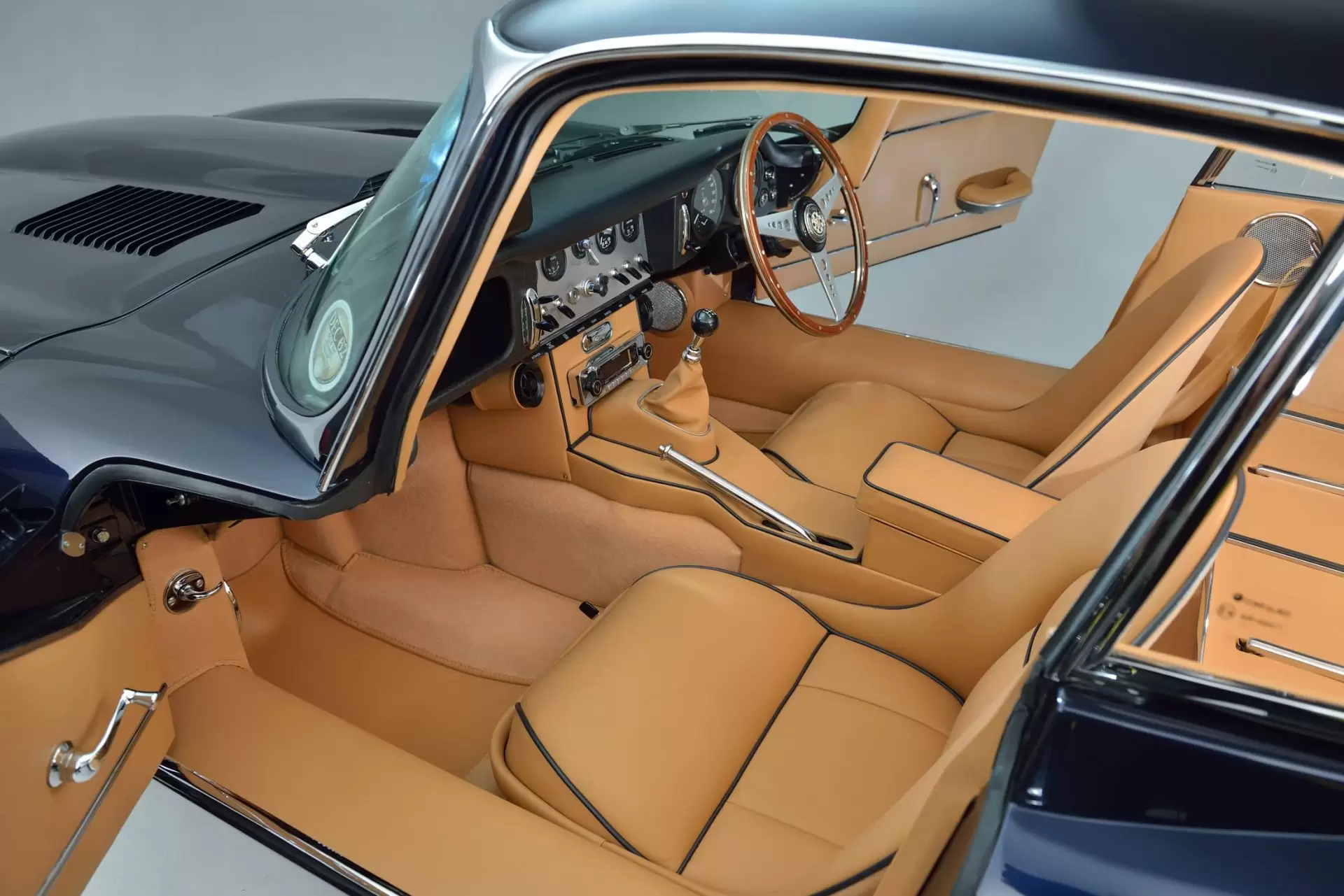 Tan interior trim and tan leather seats of Jaguar E Type S1 3.8 1962