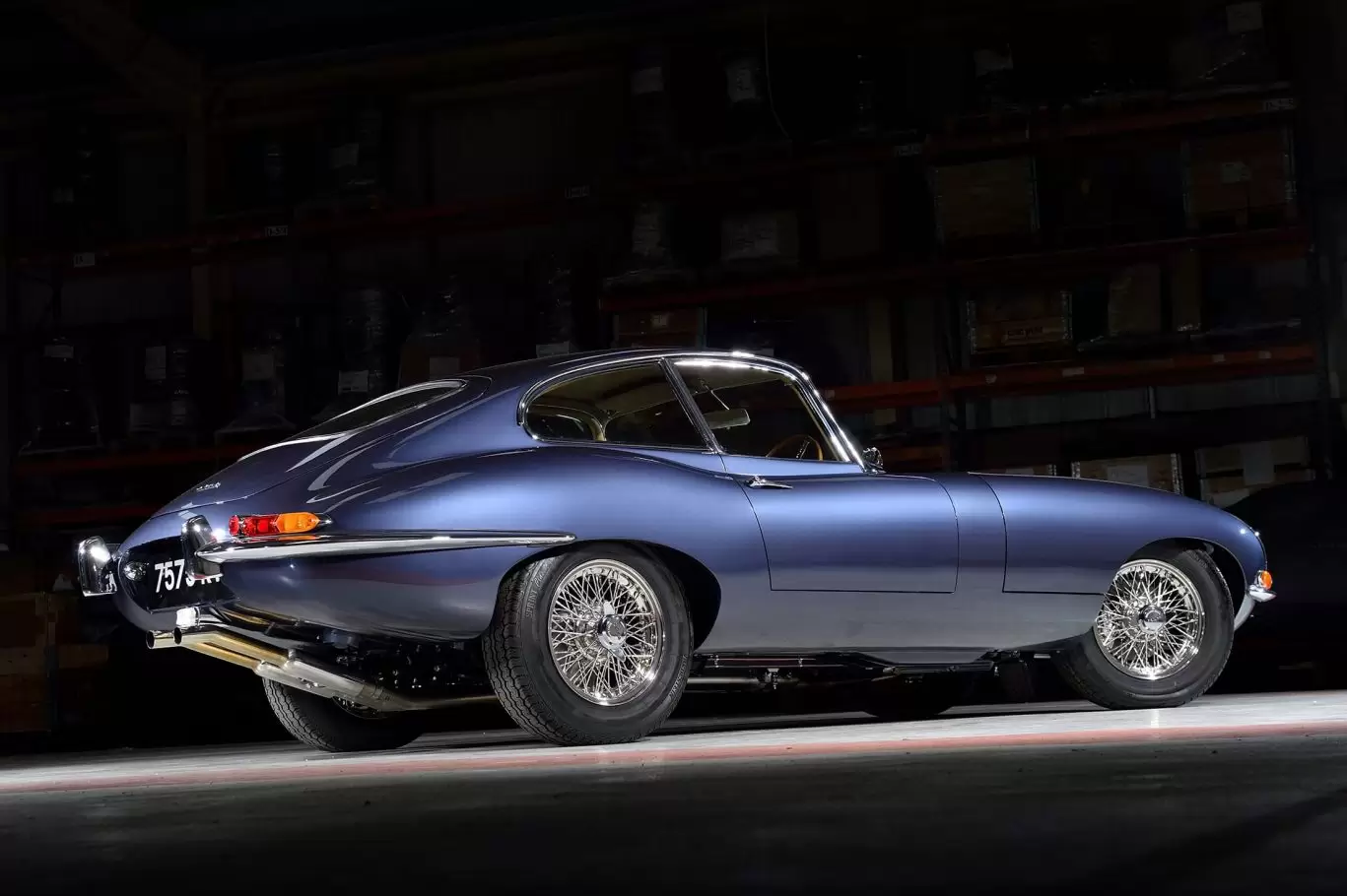 Side view of blue Jaguar E Type S1 3.8 1964