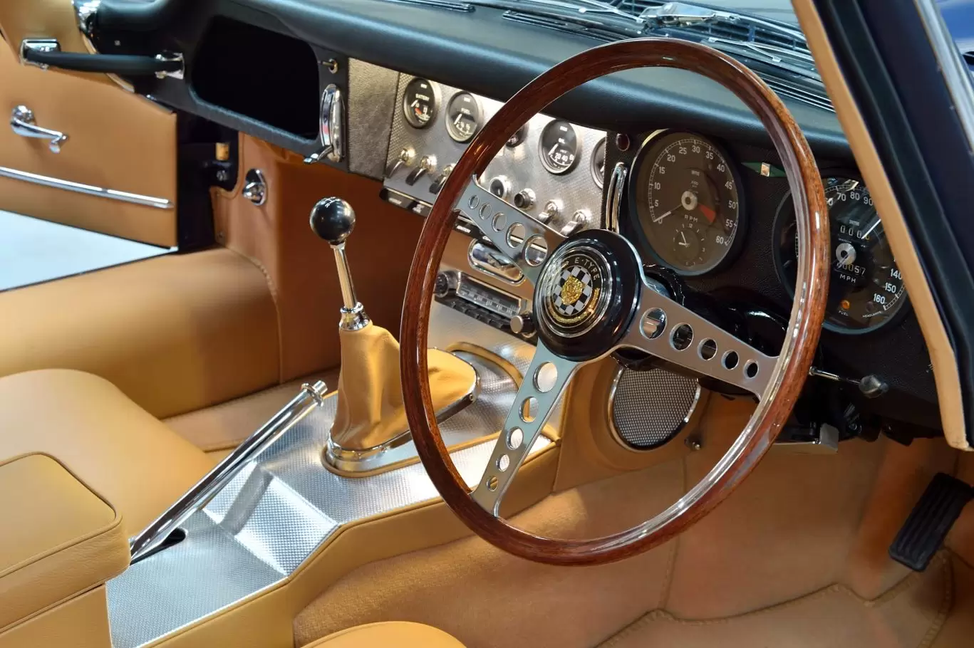 Tan interior, leather seats and steering wheel of Jaguar E Type S1 3.8 1964