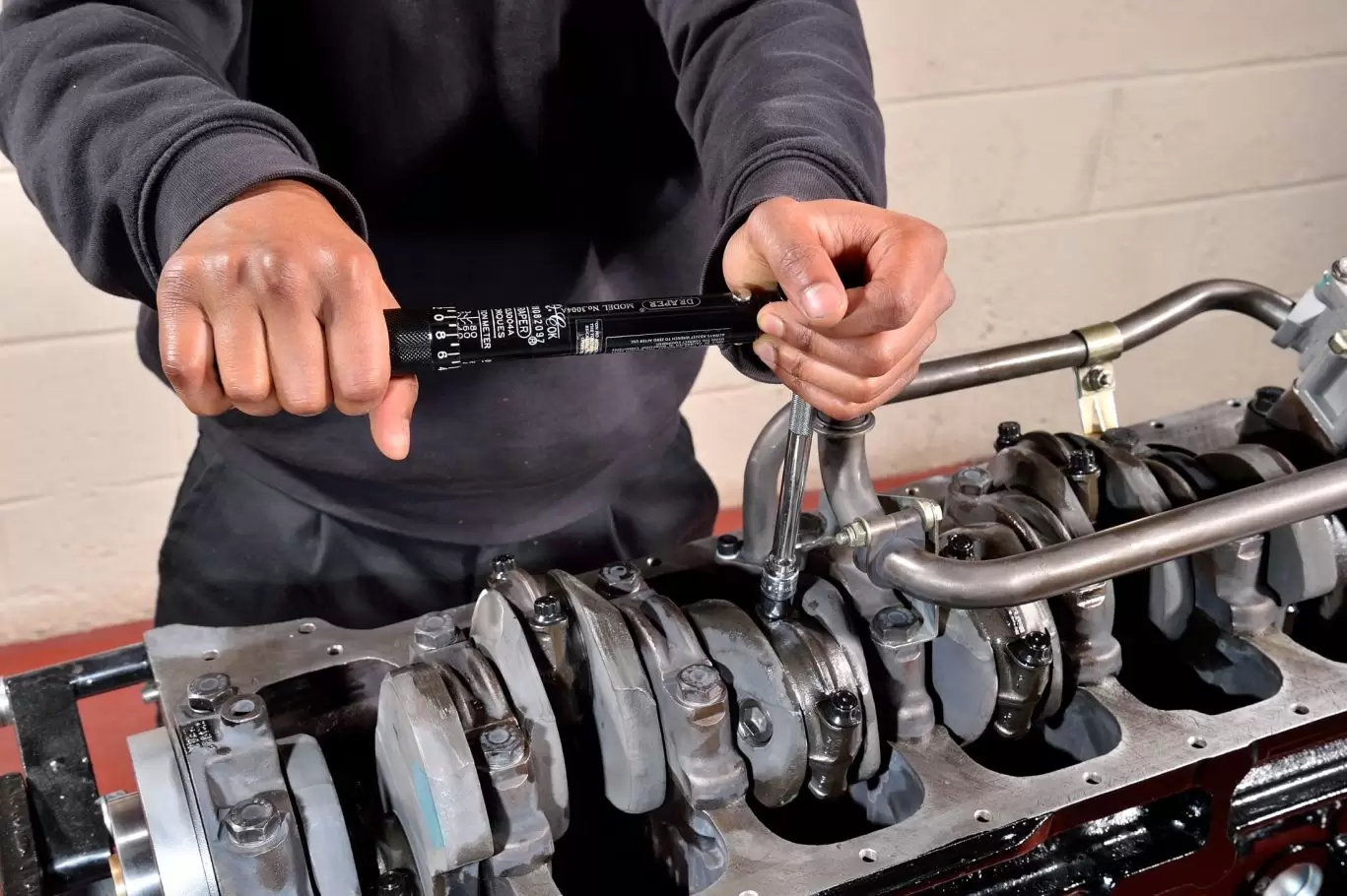 Mechanic working on engine rebuild project