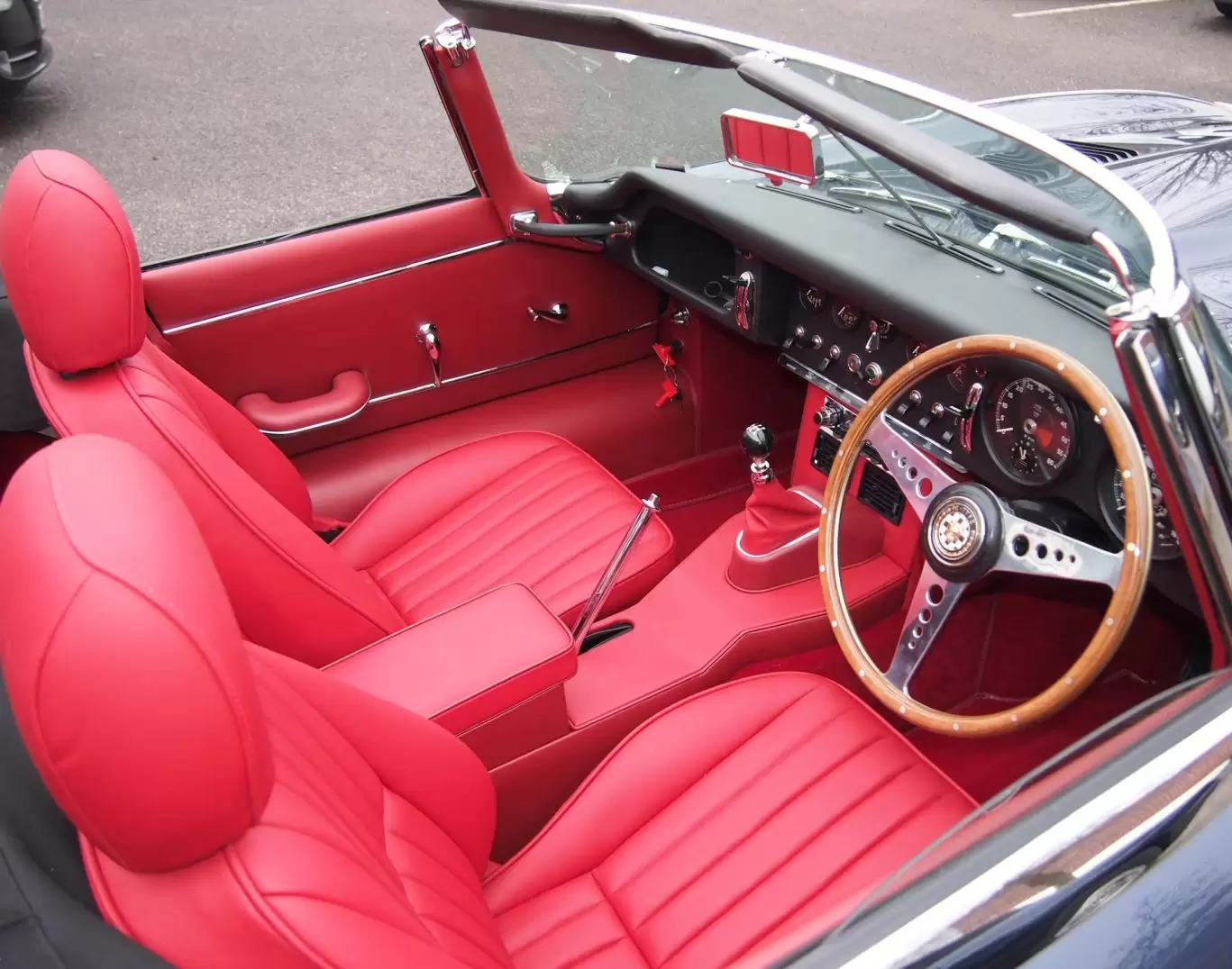 Red interior and leather seats in classic Jaguar E Type