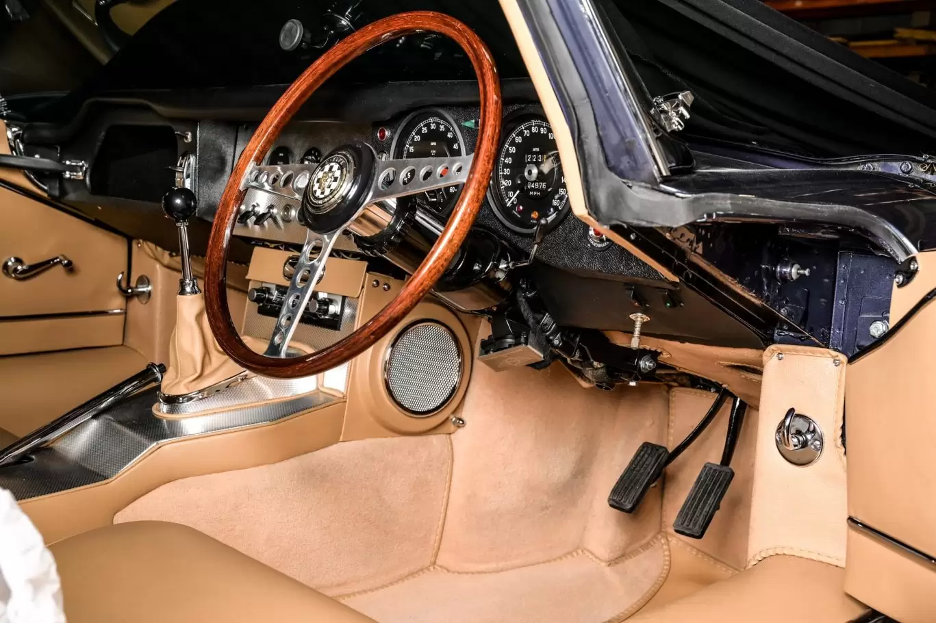 Power steering unit in classic car with tan interior and leather seats
