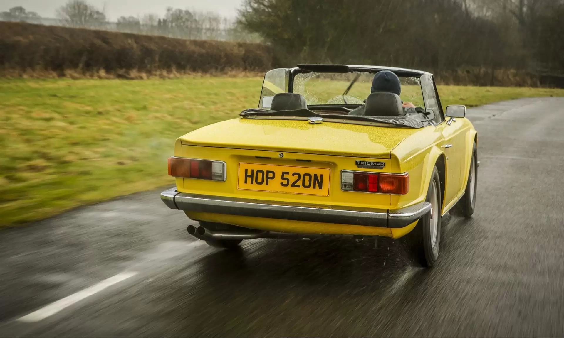 Rear view of yellow Triumph