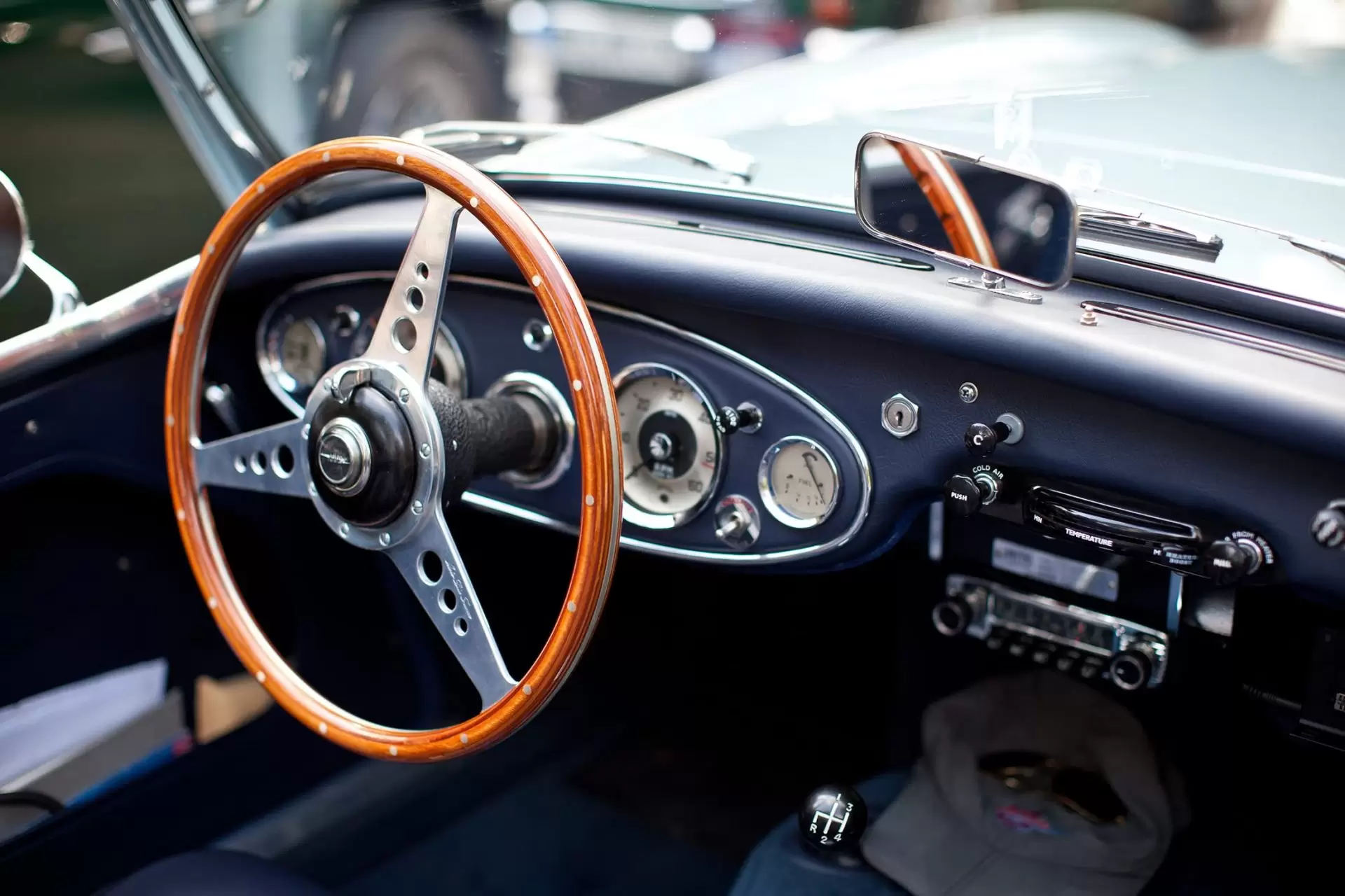 Black interior and steering wheel of Austin Healey